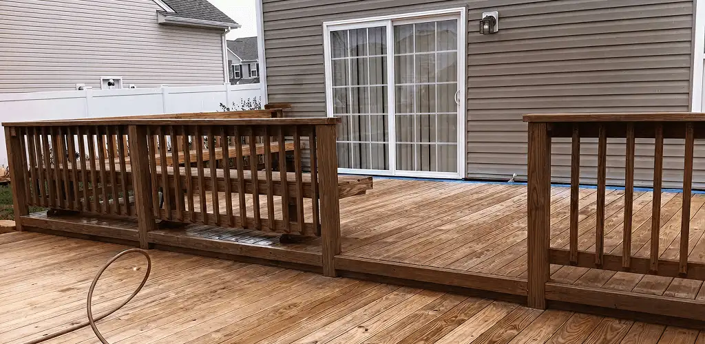 Deck sealing service protecting a backyard wood deck and railings in Los Angeles, CA